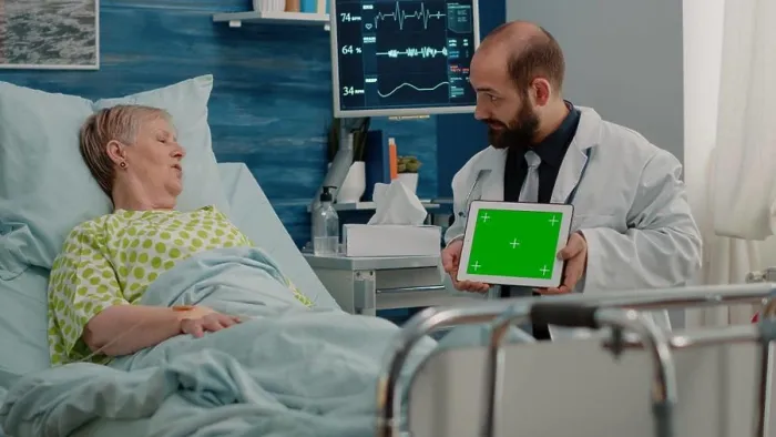 Framed Print : Doctor holding horizontal green screen on digital tablet Framed Print : Doctor holding horizontal green screen on digital tablet