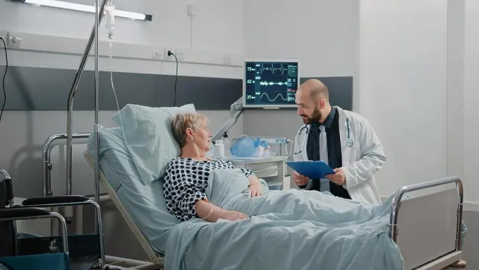 Framed Print : Doctor talking to elder patient about disease and treatment Framed Print : Doctor talking to elder patient about disease and treatment