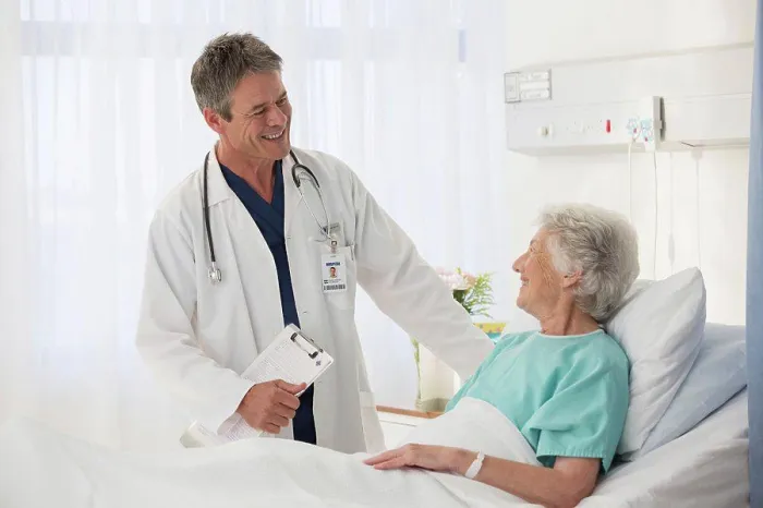 Framed Print : Doctor talking to elderly patient in hospital Framed Print : Doctor talking to elderly patient in hospital