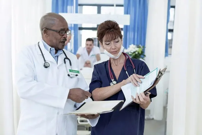 Framed Print : Two doctors in hospital talking