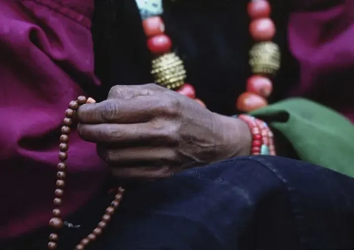 Framed Print : DOLPO WOMAN counts beads on her BUDDHIST ROSARY and wears a CORAL, TURQUOISE and GOLD NECKLACE - DOLPO DISTRICT, NEPAL Framed Print : DOLPO WOMAN counts beads on her BUDDHIST ROSARY and wears a CORAL, TURQUOISE and GOLD NECKLACE - DOLPO DISTRICT, NEPAL
