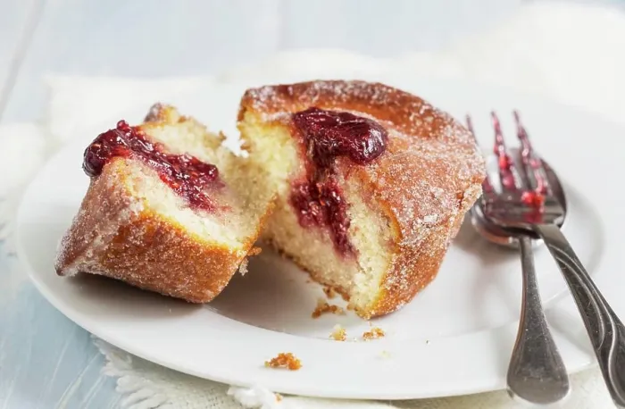 Framed Print : A doughnut muffin with raspberry jam, sliced