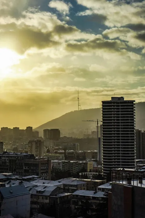 Framed Print : Dramatic sky over Tbilisi city Dramatic sky over Tbilisi citys downtown in winter with sun rays and snow Copyright