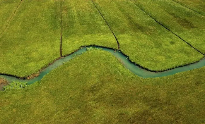 Framed Print : Drone view of Zeller Ache river flowing through green meadow Framed Print : Drone view of Zeller Ache river flowing through green meadow
