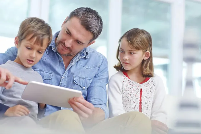 Framed Print : Education, learning or tablet with father and children on sofa in living room together for bonding or study Framed Print : Education, learning or tablet with father and children on sofa in living room together for bonding or study