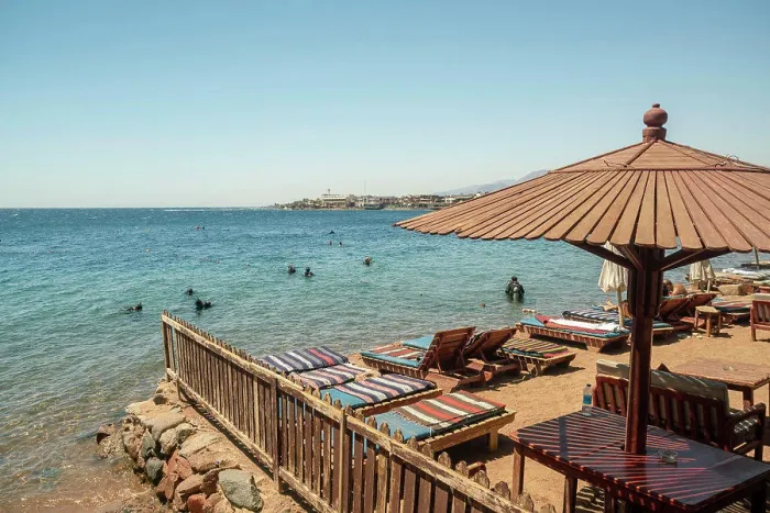 Framed Print : Egypt, Sinai, Beach with sunbeds and people bathing in sea Framed Print : Egypt, Sinai, Beach with sunbeds and people bathing in sea