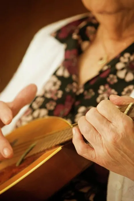 Framed Print : Elderly Woman Playing A Mandolin