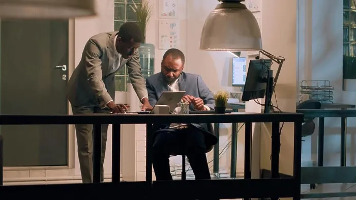 Framed Print : Employee helps coworker solve tasks Framed Print : Employee helps coworker solve tasks