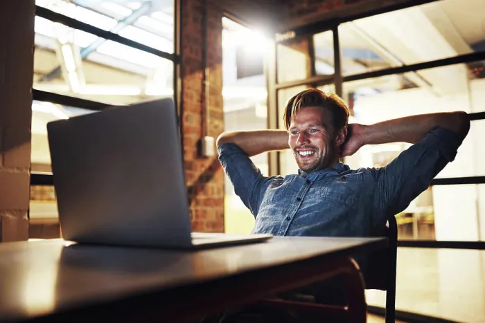 Framed Print : Employee, man and laid back on laptop at night with smile for email Framed Print : Employee, man and laid back on laptop at night with smile for email