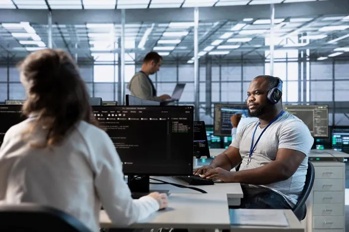 Framed Print : Engineer in data center coordinating deployment of server architecture