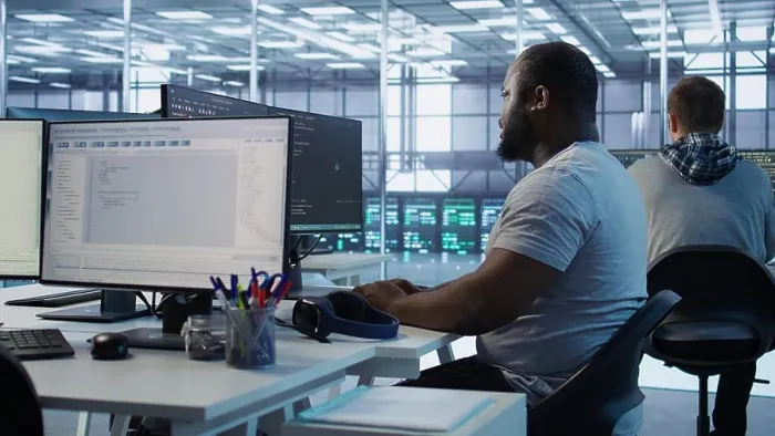Framed Print : Engineer writing code and doing checkup on server room providing computing resources for different workloads