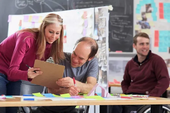 Framed Print : Engineering students actively brainstorming in ideation lab