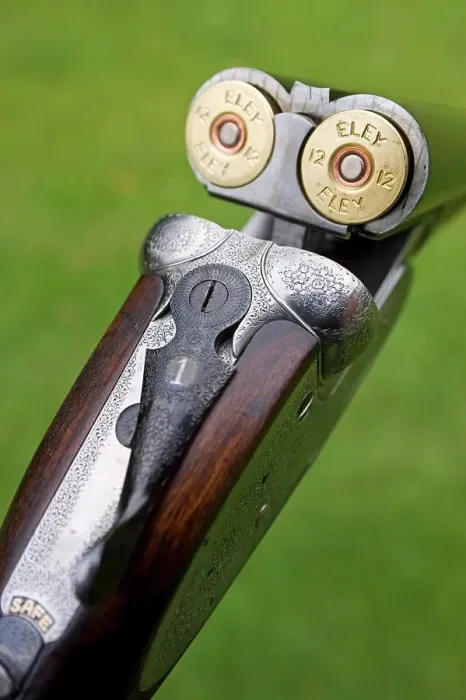 Framed Print : England; A fine side-by-side 12 bore shotgun made by premier English gunsmiths James Purdey and Sons