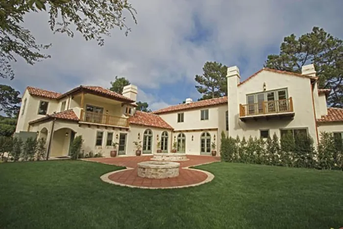 Framed Print : Exterior of a SPANISH STYLE LUXURY HOME with stucco walls and red tile roof