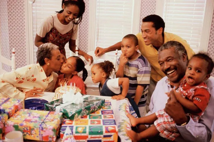 Framed Print : Family celebrating a birthday party Framed Print : Family celebrating a birthday party