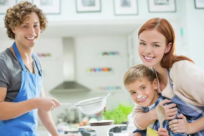 Framed Print : Family cooking together in kitchen, London, UK