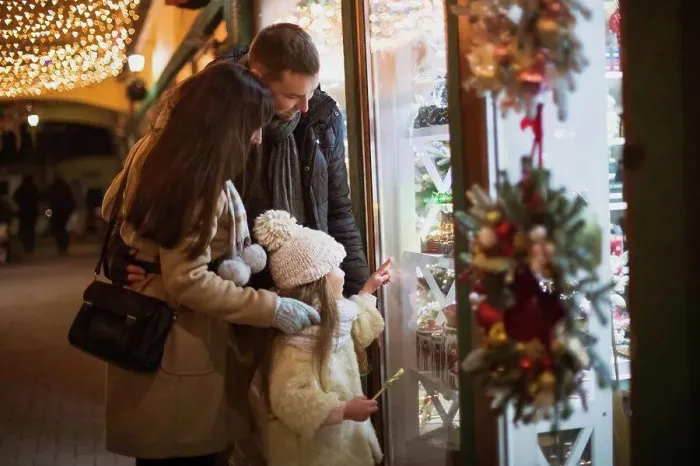 Framed Print : Family walk and look at the shop showcase with Christmas decorations Framed Print : Family walk and look at the shop showcase with Christmas decorations