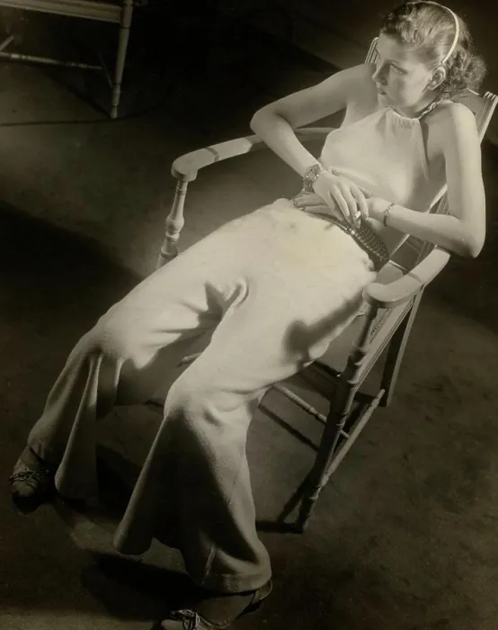 Framed Print : Fashion model sitting in armchair in elegant clothing