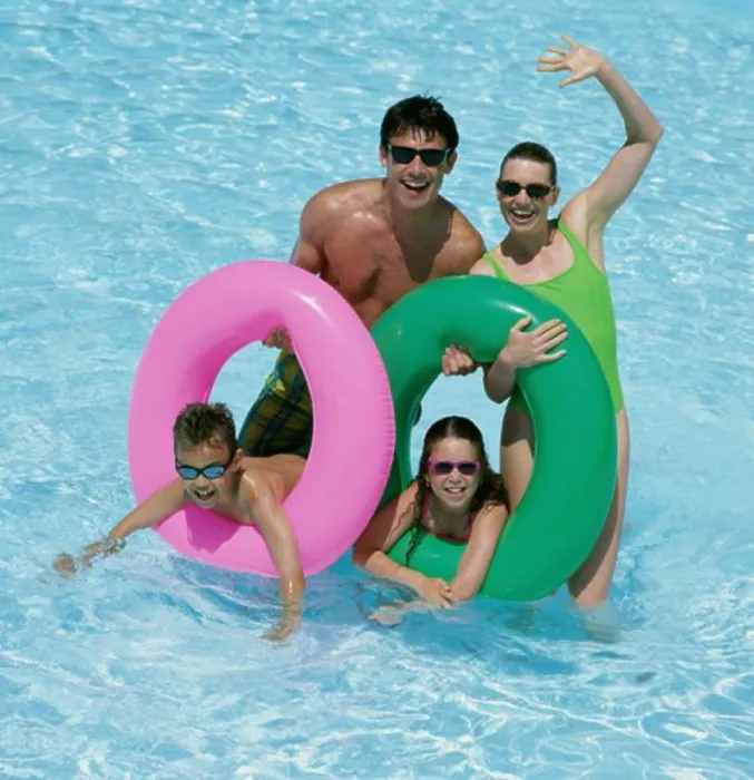 Framed Print : Father and mother with their daughter and son in a swimming pool Framed Print : Father and mother with their daughter and son in a swimming pool