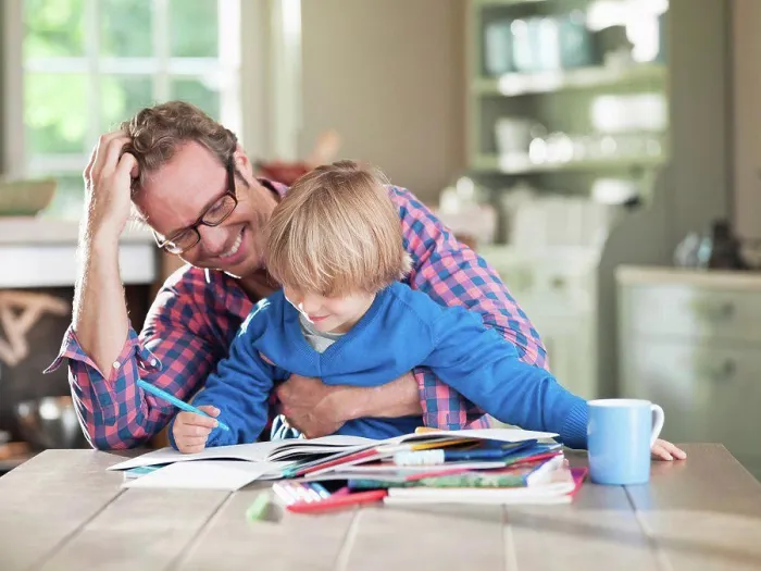 Framed Print : Father and son doing homework at kitchen table, Hamburg, Germany Framed Print : Father and son doing homework at kitchen table, Hamburg, Germany
