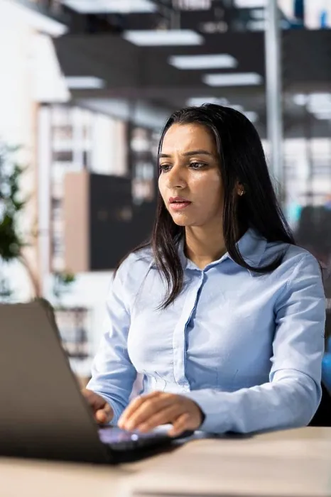 Framed Print : Female executive analyst finalizes a financial report and reviews data Framed Print : Female executive analyst finalizes a financial report and reviews data
