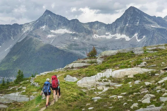 Framed Print : Two female hikers with black dog on Abbott Ridge Trail. Selkirk Mountains Glacier National Park British Columbia