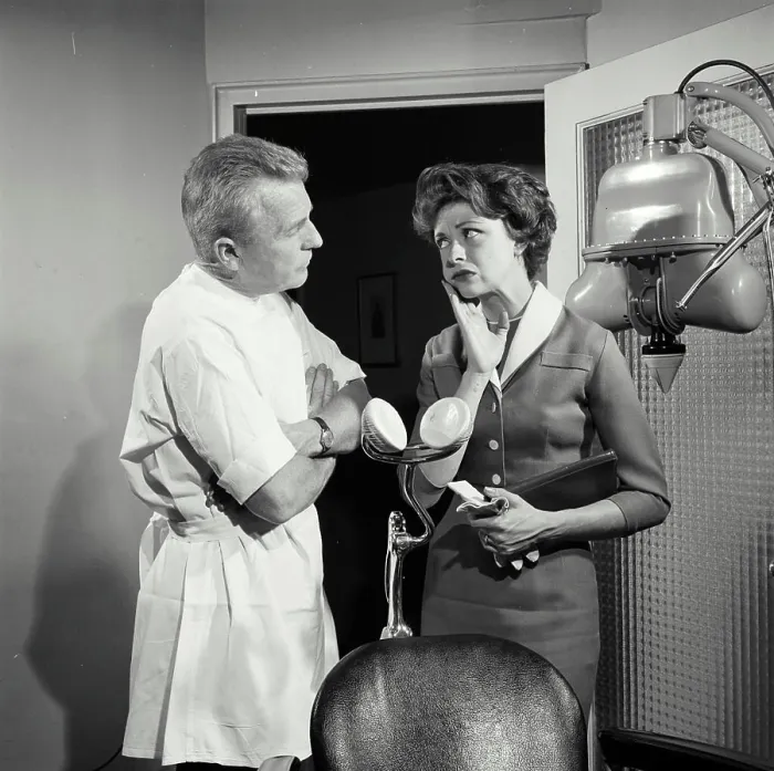 Framed Print : Female patient suffering from toothache standing with dentist Framed Print : Female patient suffering from toothache standing with dentist