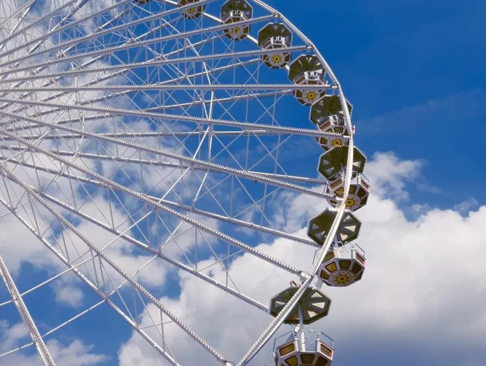 Framed Print : Ferris wheel in the park, a close-up view from the bottom against the blue sky Framed Print : Ferris wheel in the park, a close-up view from the bottom against the blue sky