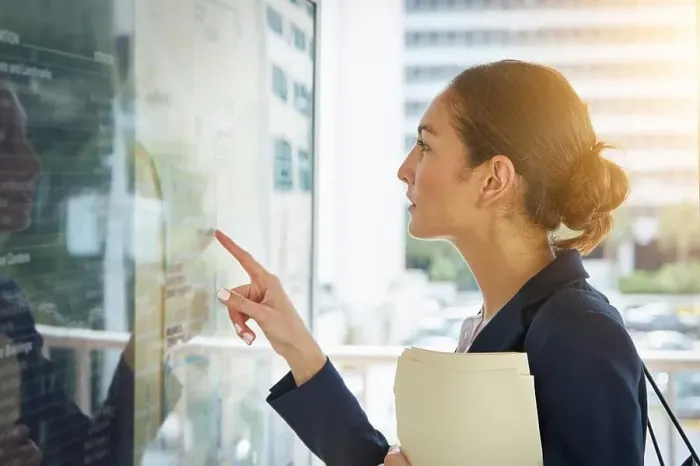 Framed Print : Finding the quickest route to commute. a businesswoman reading a route schedule while on the way to work Framed Print : Finding the quickest route to commute. a businesswoman reading a route schedule while on the way to work