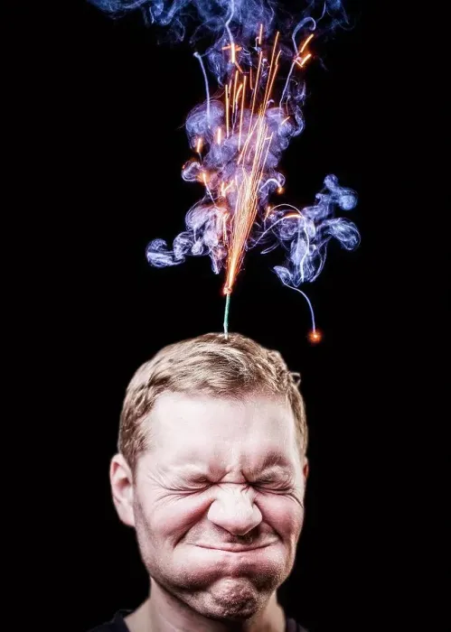 Framed Print : Fireworks emitting over mans head