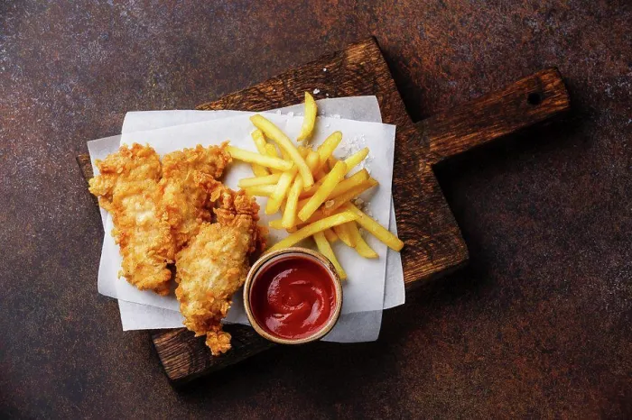 Framed Print : Fish and Chips british fast food with ketchup sauce on dark background Framed Print : Fish and Chips british fast food with ketchup sauce on dark background