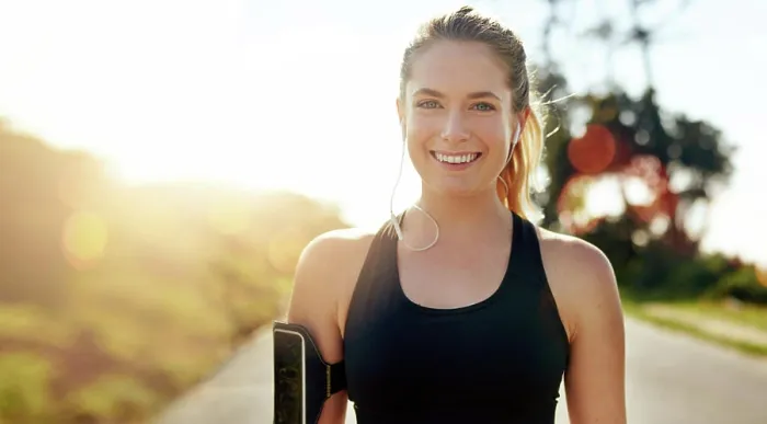 Framed Print : Fitness, portrait and happy woman with earphones outdoor on road at sunrise