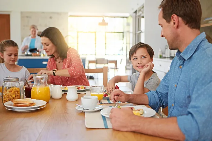 Framed Print : Food, love and morning with a family in the dining room of their home together for health or nutrition
