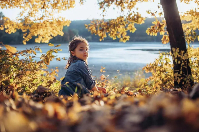 Framed Print : Girl in autumn nature, sitting on fallen leaves Framed Print : Girl in autumn nature, sitting on fallen leaves