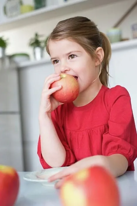 Framed Print : Girl eating an apple Framed Print : Girl eating an apple