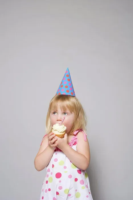 Framed Print : Girl eating a cupcake Framed Print : Girl eating a cupcake