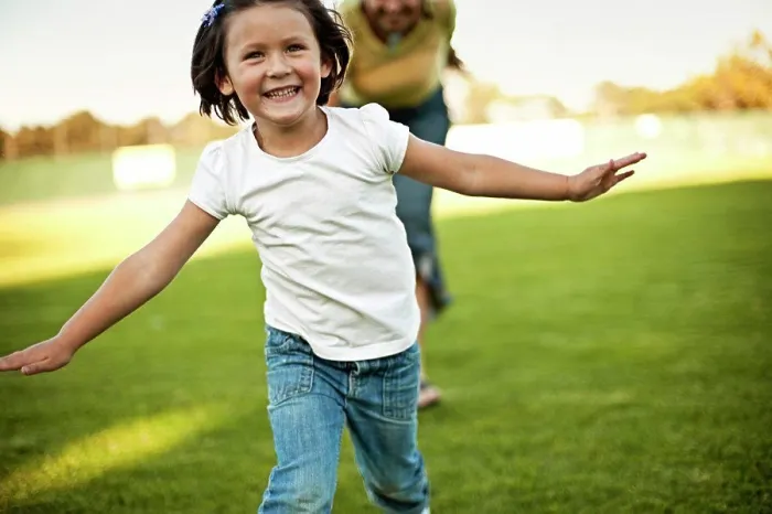 Framed Print : Girl and grandmother running through park Framed Print : Girl and grandmother running through park