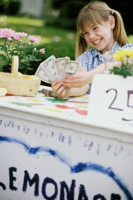 Framed Print : Girl making money at a lemonade stand Framed Print : Girl making money at a lemonade stand