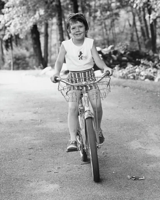 Framed Print : Girl riding a bicycle