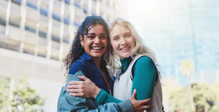Framed Print : Girls, happy and hug outdoor in urban city with trendy fashion for travel