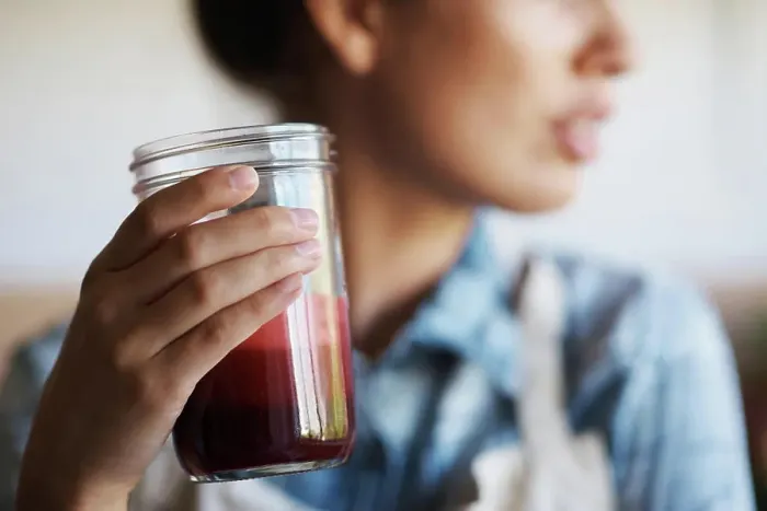 Framed Print : Glass, hand and smoothie with woman in kitchen of home closeup for diet Framed Print : Glass, hand and smoothie with woman in kitchen of home closeup for diet