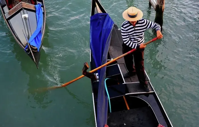 Framed Print : Gondolier Rowing A Gondola On Canal In Venice, Italy, Europe Framed Print : Gondolier Rowing A Gondola On Canal In Venice, Italy, Europe