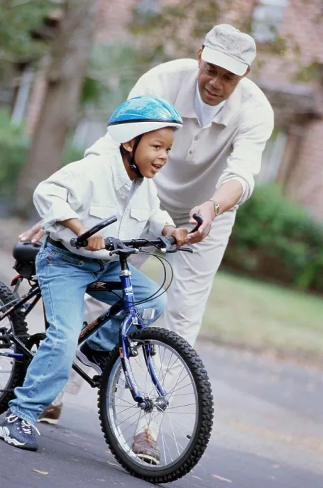 Framed Print : Grandfather teaching his grandson ride a bicycle Framed Print : Grandfather teaching his grandson ride a bicycle