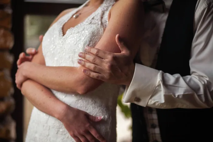 Framed Print : groom gently embraces the bride The hand of the groom gently embraces the bride Framed Print : groom gently embraces the bride The hand of the groom gently embraces the bride