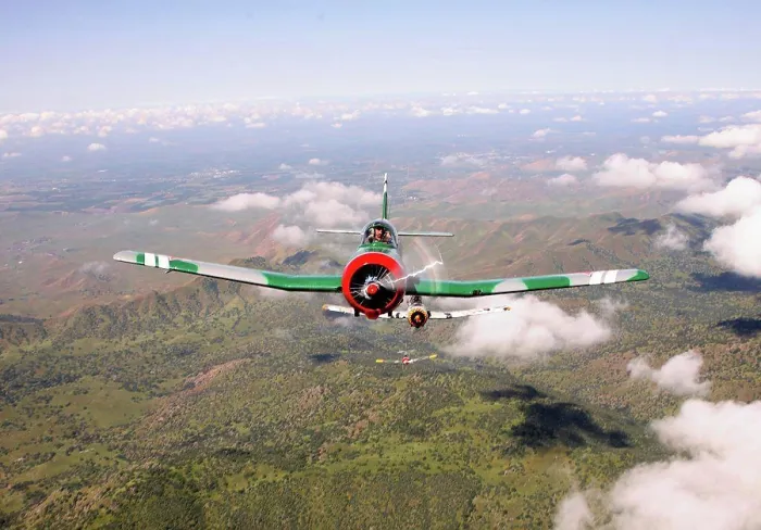 Framed Print : Group of 1960 Nanchang China CJ-6 aerobatic trainer aircraft flying over mountains in California. Straight on nose view Framed Print : Group of 1960 Nanchang China CJ-6 aerobatic trainer aircraft flying over mountains in California. Straight on nose view