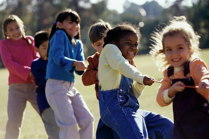 Framed Print : Group of children playing tug-of-war Framed Print : Group of children playing tug-of-war