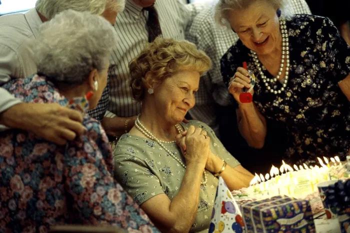 Framed Print : Group of senior people celebrating at a birthday party Framed Print : Group of senior people celebrating at a birthday party