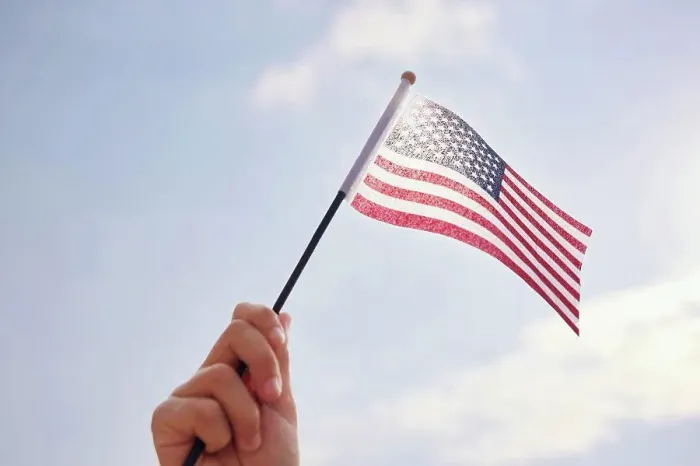 Framed Print : Hand holding American Flag Framed Print : Hand holding American Flag