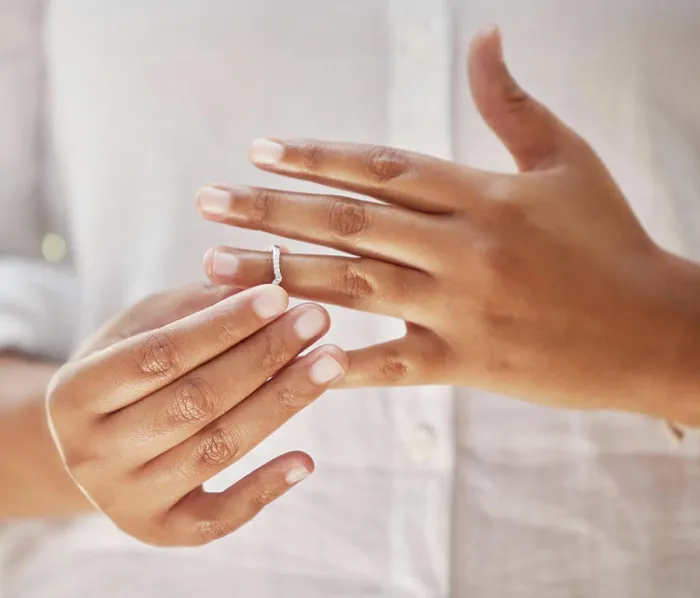Framed Print : Hands, removing and wedding ring in divorce Framed Print : Hands, removing and wedding ring in divorce