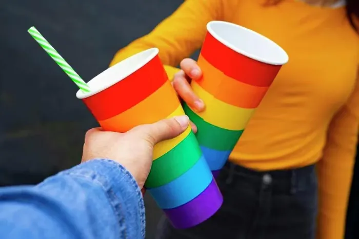 Framed Print : Hands toasting with rainbow pride cups at a party Framed Print : Hands toasting with rainbow pride cups at a party
